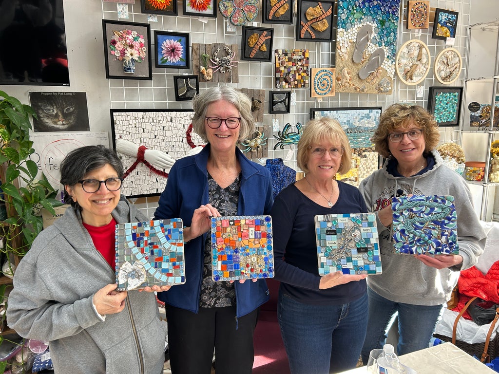 four people holding mosaic